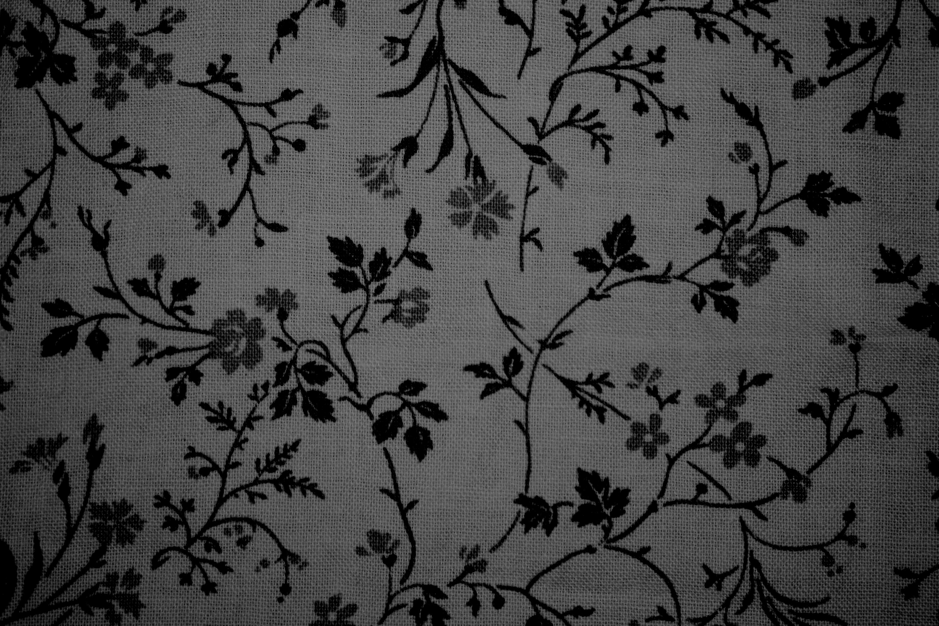 https://www.photos-public-domain.com/wp-content/uploads/2012/06/black-on-gray-floral-print-fabric-texture.jpg