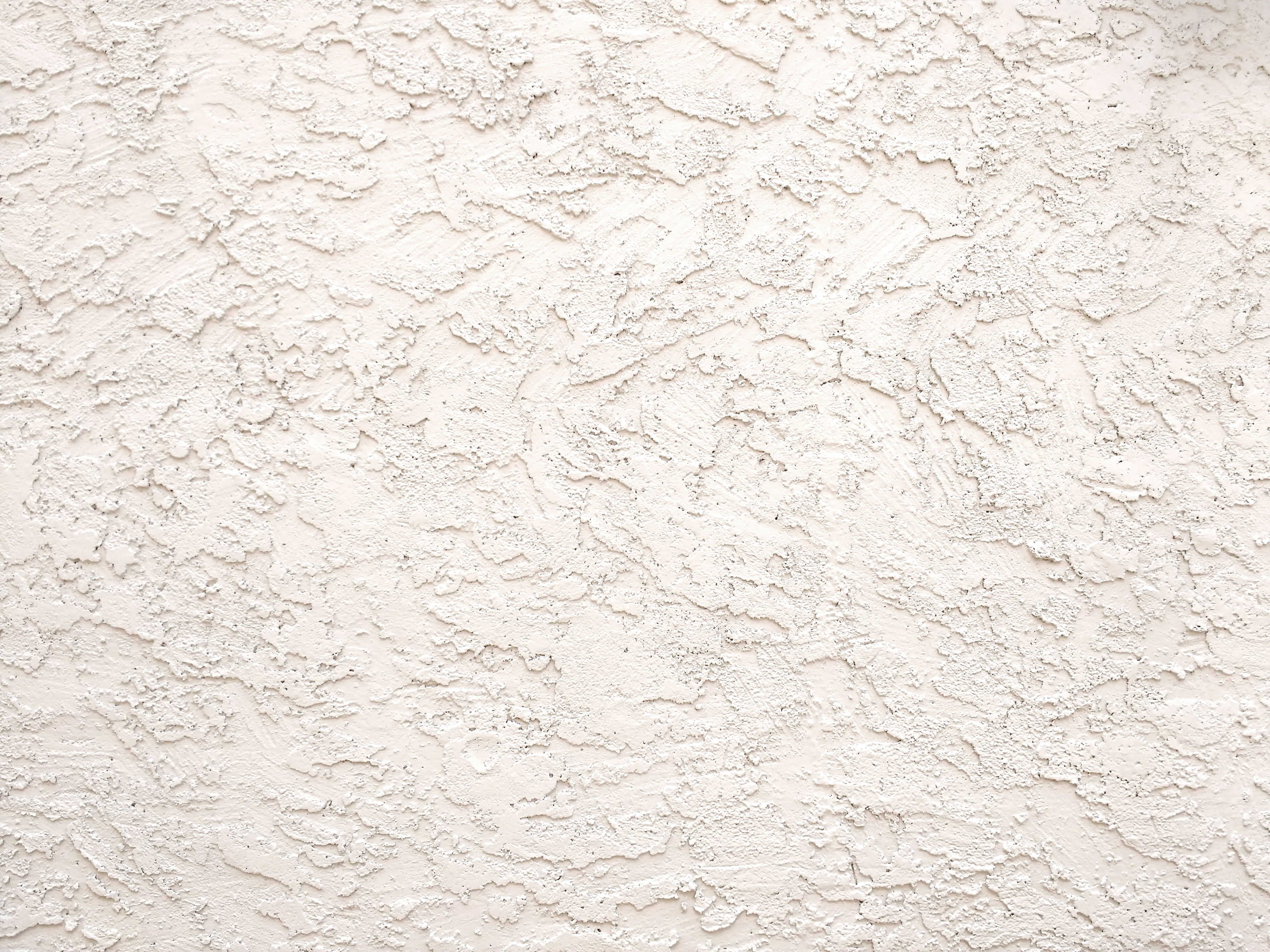 A close up of a white stucco wall photo – Off white colour Image on Unsplash